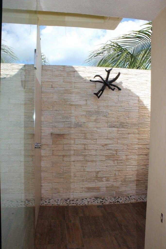 Outdoor shower inside an El Dorado Casitas Royale suite