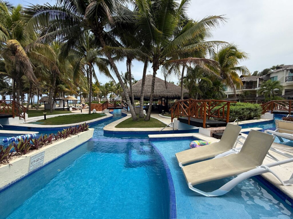 Lazy river style pool winding through El Dorado Casitas Royale