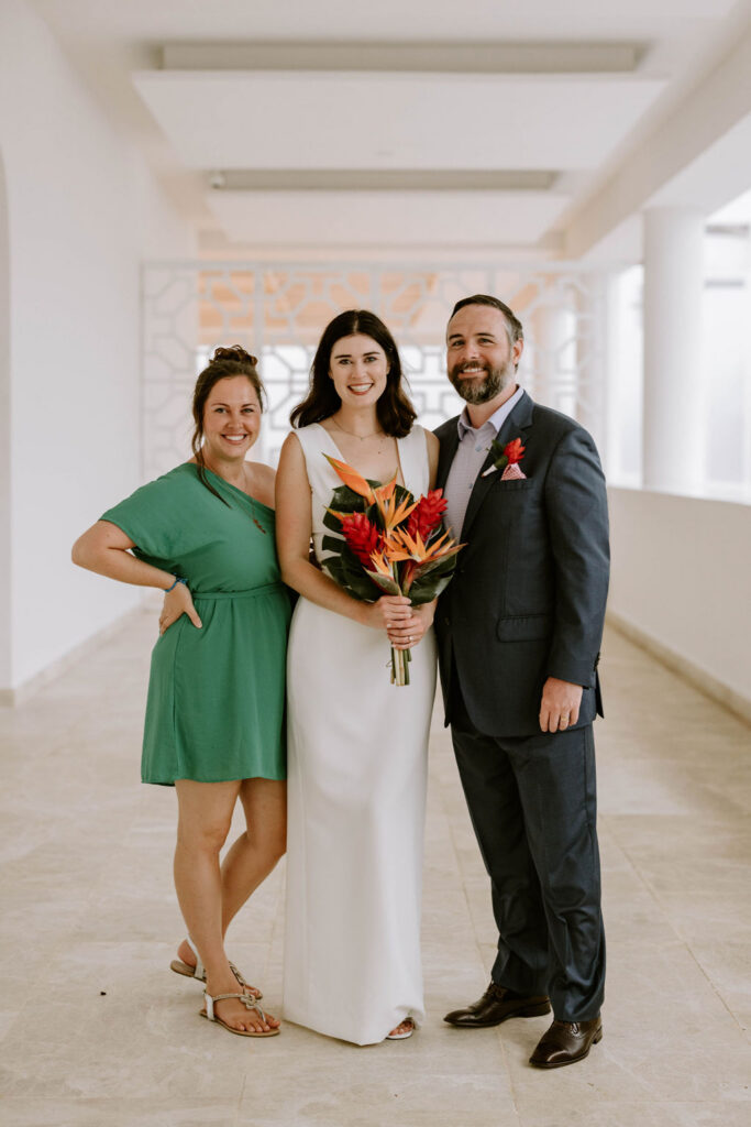 Destination wedding planner with newlyweds following their wedding ceremony at Majestic Elegance Costa Mujeres.
