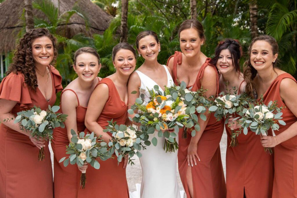 Bride with bridesmaids wearing terracotta dresses at El Dorado Casitas Royale