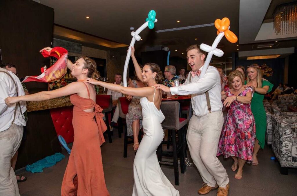Guests celebrating during the wedding reception at El Dorado Casitas Royale