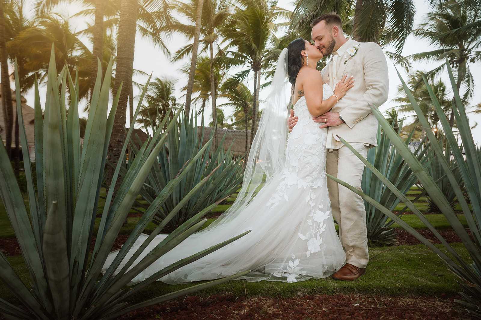 Romantic wedding portrait among agave plants at El Dorado Royale Resort