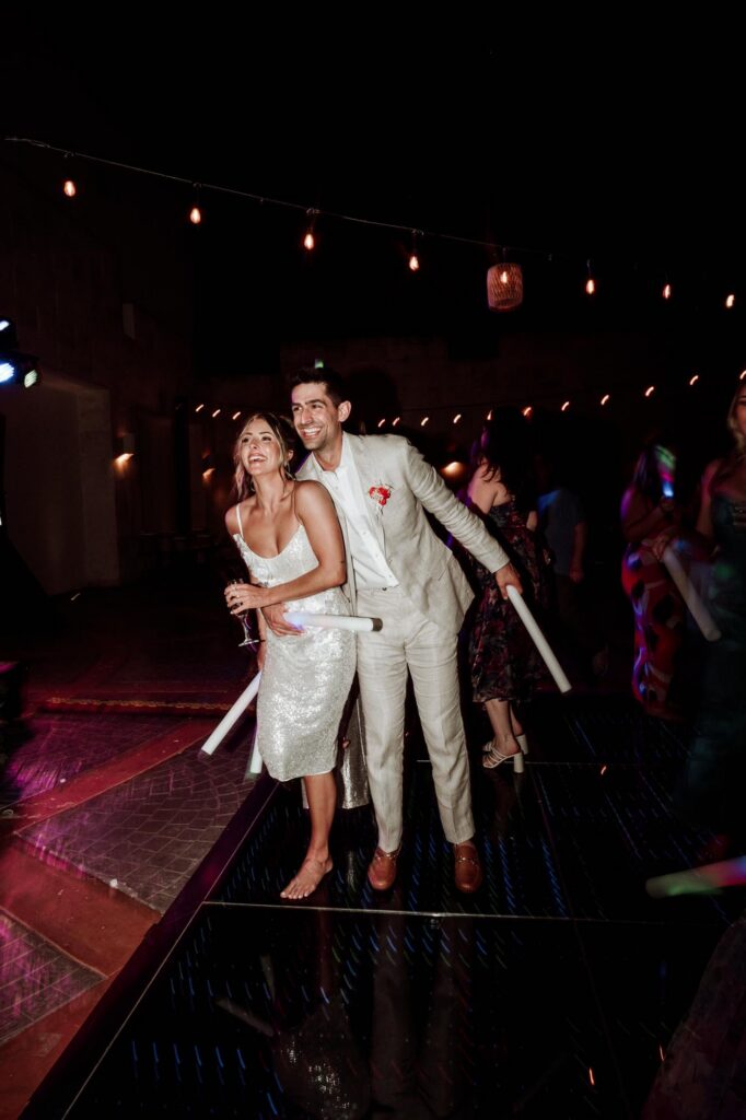 Couple enjoying their wedding reception planned by Morgan, one of the best travel agents specializing in destination weddings