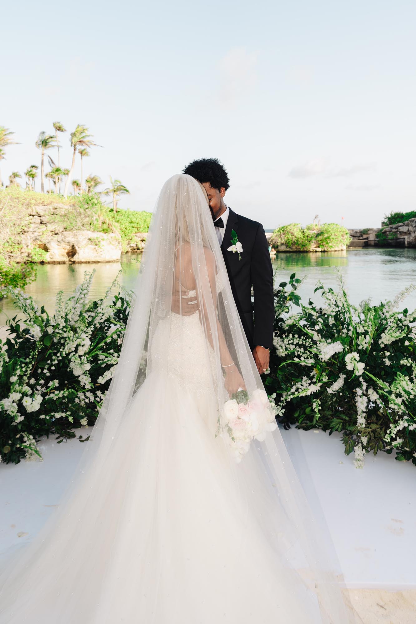 Couple relaxed on their wedding day, showing why it matters to ​have a wedding planner for destination wedding