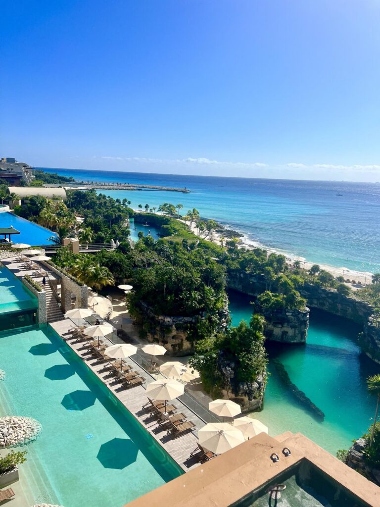 Pools and ocean at Hotel Xcaret Arte in Riviera Maya, Mexico, one of the best all inclusive resorts for a honeymoon in Mexico​