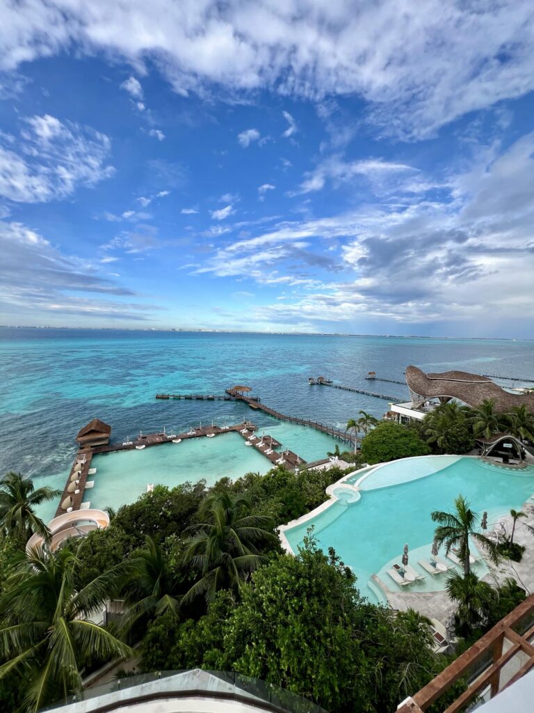 Pools and the ocean at one of the best all inclusive honeymoon resorts in mexico​, Impression Isla Mujeres close to Cancun, Mexico