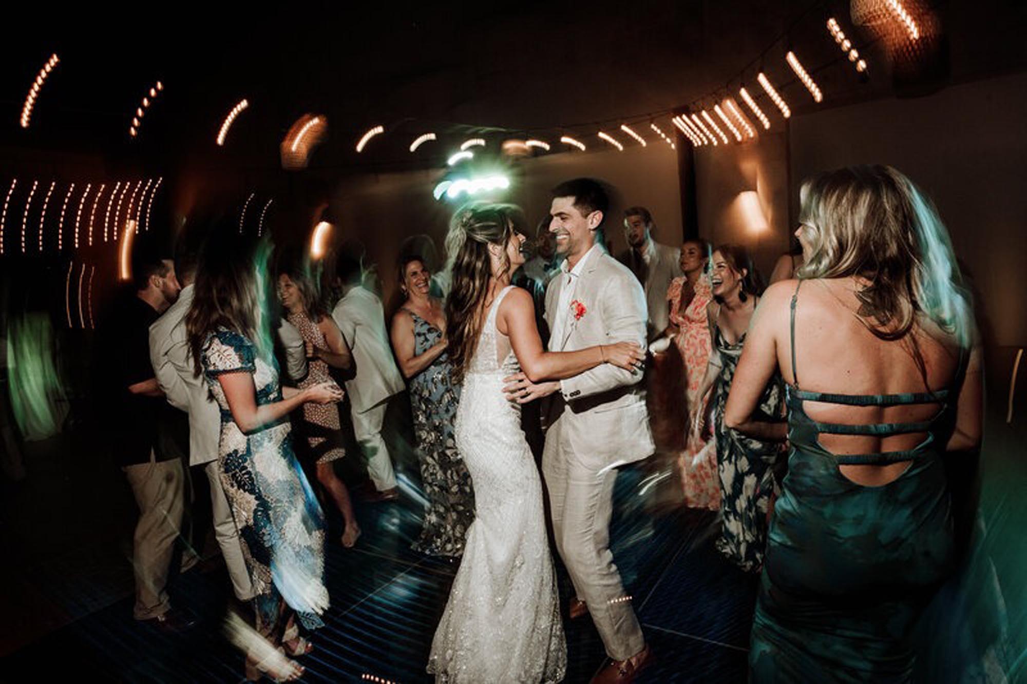 Couple partying at one of the best places to have a destination wedding in mexico 