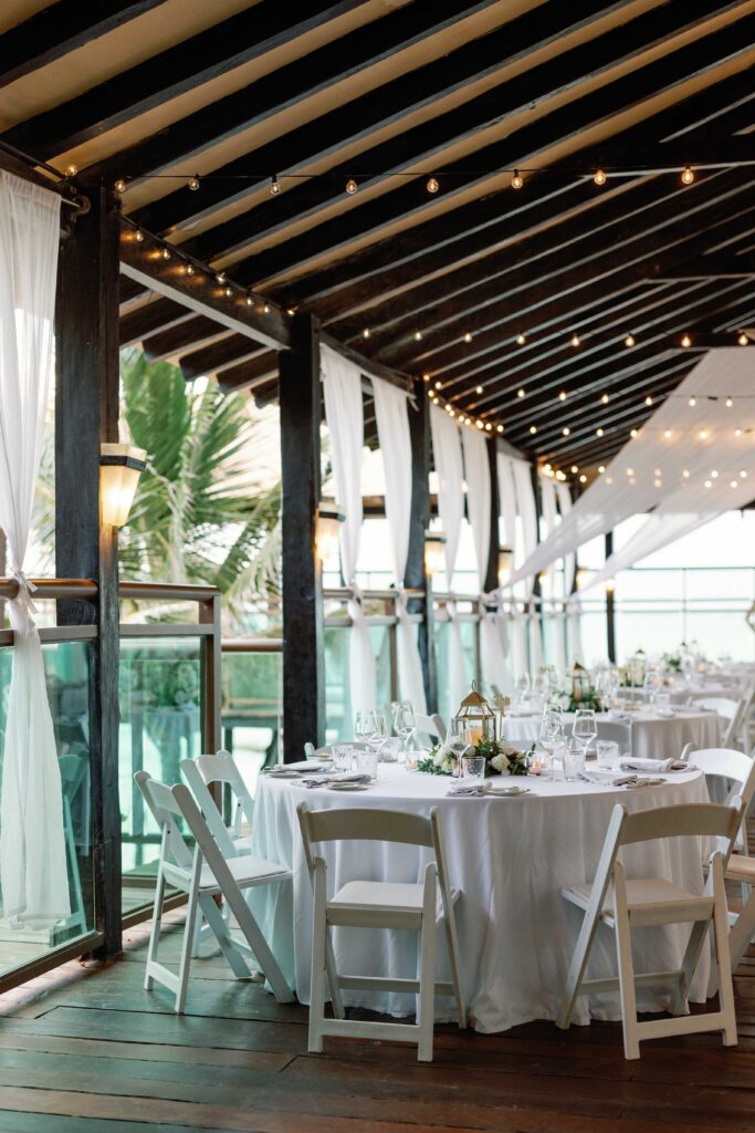 Reception tables and decor on the Pier Deck at Generations Riviera Maya