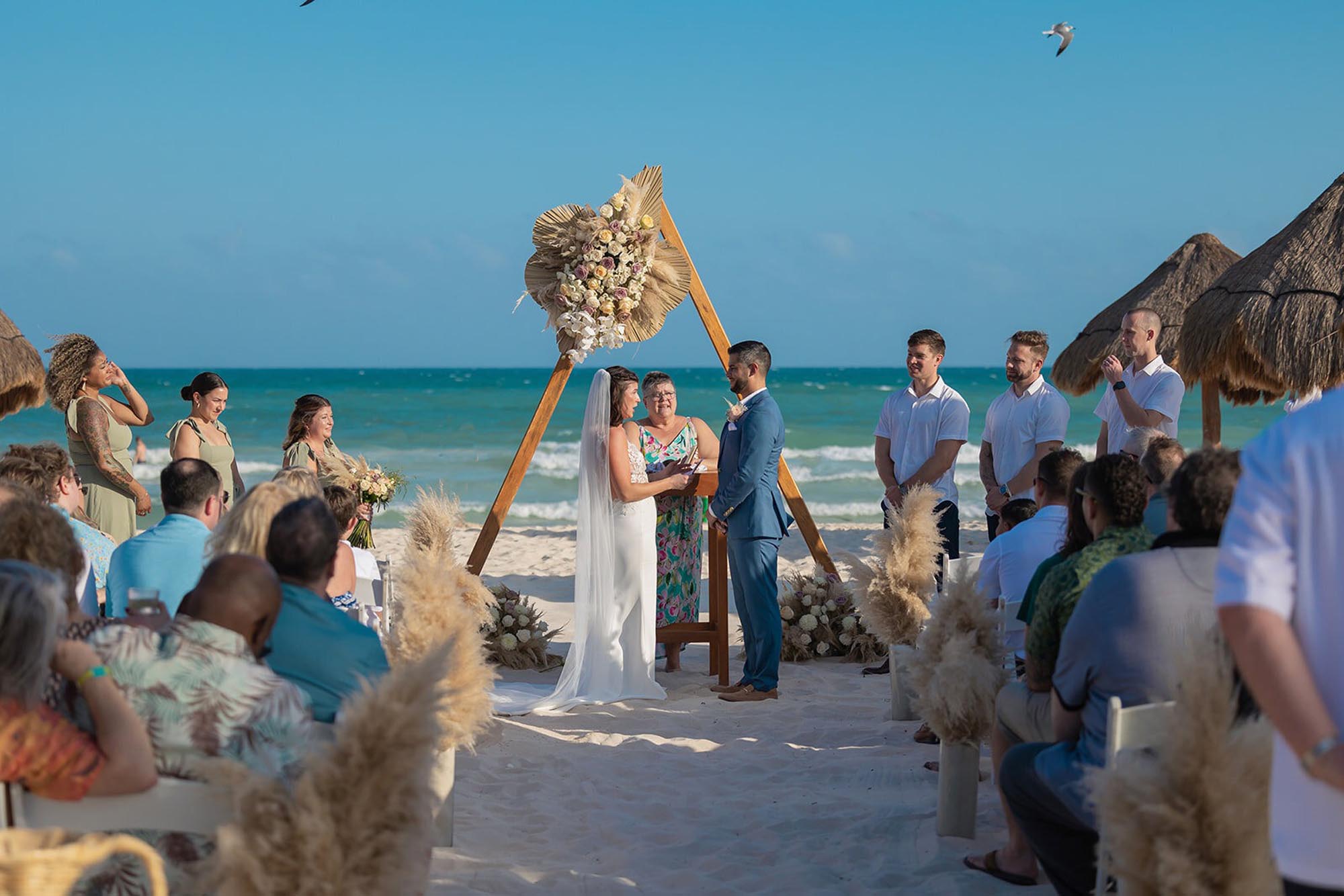 Ceremony on the beach, showing how to plan a destination wedding in Mexico with Making Memories by Morgan