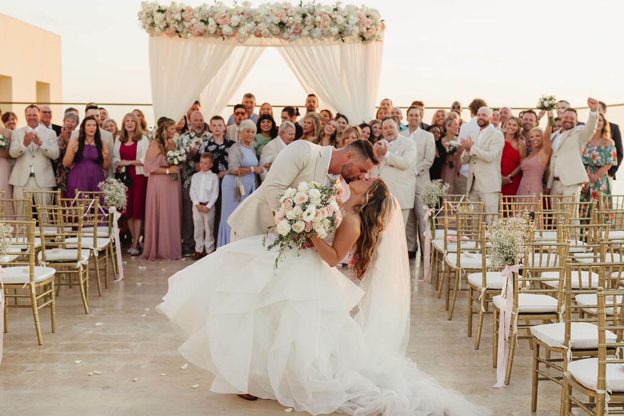 Couple having an amazing time because they learned how to plan a destination wedding in Mexico