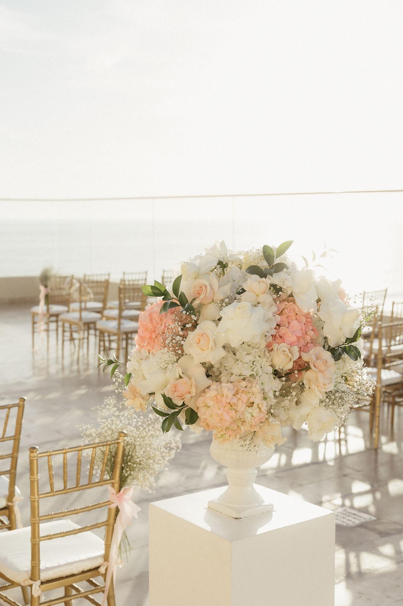 Ceremony set up and florals, showing ​who is an expert destination wedding travel agent