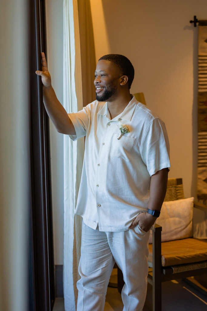 Groom getting ready in an alcoba suite before an intimate wedding at Unico 2087 Riviera Maya