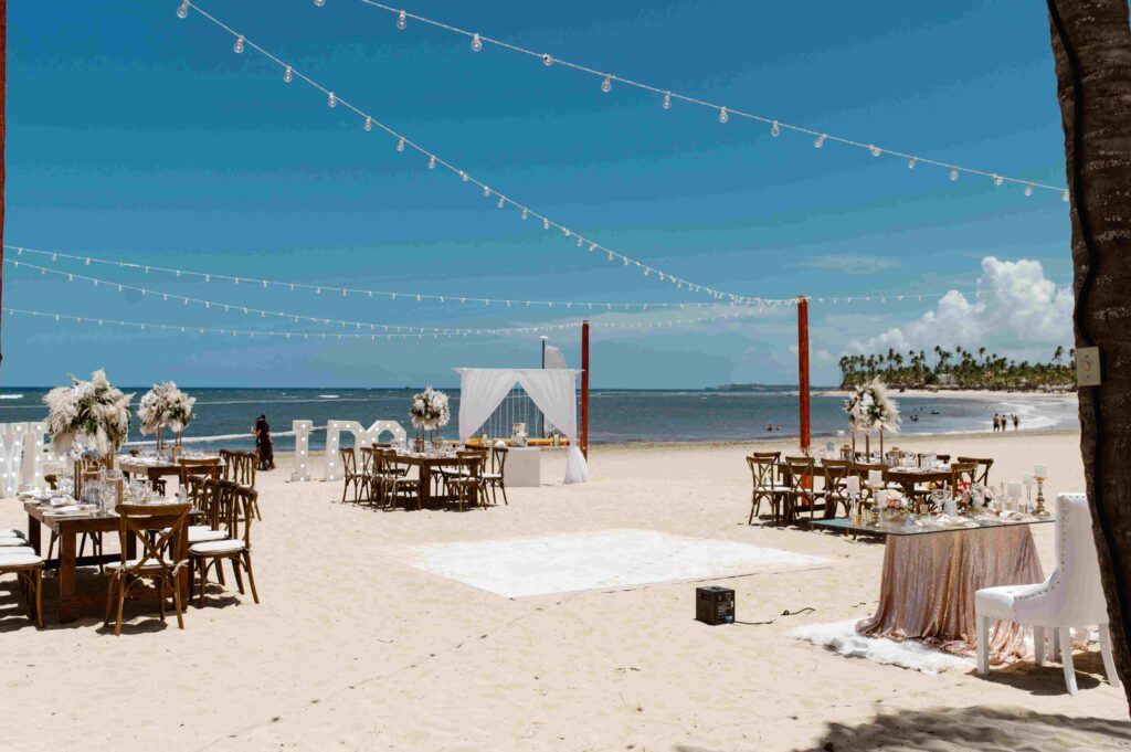 Destination wedding beach reception with string lights, marquee letters, and dance floor in Punta Cana, Dominican Republic